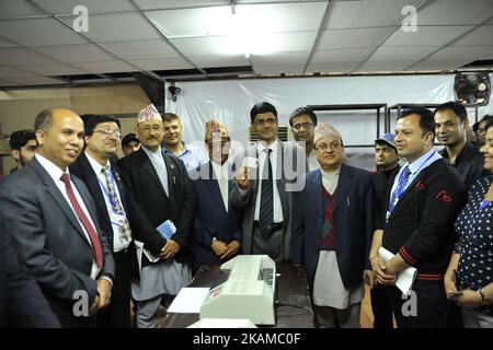 Election Commissioner Secretary Gopinath Mainali, Election Commissioner, Sudhir Kumar Shah, Ishwori Prasad Paudyal, Chief Election Commissioner Dr. Ayodhee Prasad Yadav and Narendra Dahal and other staff of Election Commission showing the voters' identity card after checking at Election Commission Building, Kathmandu, Nepal on Monday, April 03, 2017. The Election Commission has started printing voters' identity cards for upcoming local level election scheduled on May 14, 2017. The Election Commission approved the name of 14.54 million voters for the local level election on Sunday, April 02, 20 Stock Photo