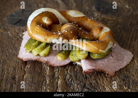Meat Loaf In A Pretzel On Wood Stock Photo