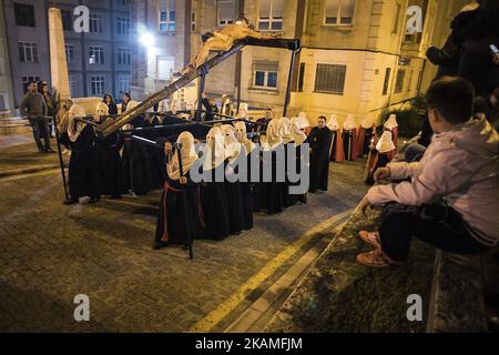 The brotherhoods of the holy burial carry a step with the figure of a Christ lying during the nocturnal procession of holy mercy. (Photo by Joaquin Gomez Sastre/NurPhoto) *** Please Use Credit from Credit Field *** Stock Photo