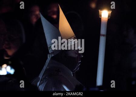 Pope Francis presides over a solemn Easter vigil ceremony in St. Peter's Basilica at the Vatican, Saturday, April 15, 2017. Holding a single candle, Francis processed down the center aisle of a darkened St. Peter's Basilica, symbolizing the darkness that fell after Jesus' crucifixion on Good Friday. (Photo by Massimo Valicchia/NurPhoto) *** Please Use Credit from Credit Field *** Stock Photo