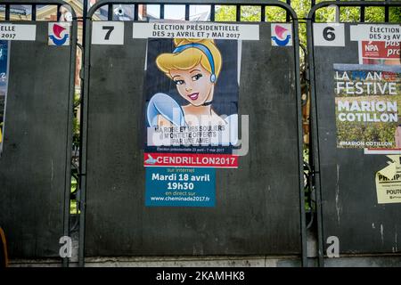 Posters of the candidates at the French Presidential Election were hacked by street artists in Paris, on April 18, 2017, one week before the first vote. (Photo by Michael Bunel/NurPhoto) *** Please Use Credit from Credit Field *** Stock Photo
