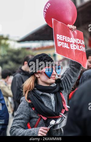 Demonstrators hold placards reading 'Referendum should be cancelled' during a protest at the Kadikoy district in Istanbul on April 23, 2017 following the results in a nationwide referendum that will hugely enhance the president Recep Erdogan powers. Turkey's main opposition party launched a legal challenge at a top court on April 21 to last-minute changes to voting rules in the referendum that saw President Recep Tayyip Erdogan win expanded powers. (Photo by Emrah Oprukcu/NurPhoto) *** Please Use Credit from Credit Field *** Stock Photo