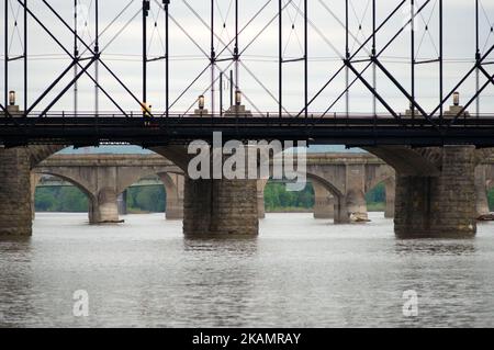 A man is seen mounting a one-mile marker on Walnut St. Bridge over the Susquehanna River, in Harrisburg, PA, on the morning of April 30, 2017. Diminishing retail, crumbling infrastructure, environmental issues, poverty and unemployment are shown in a view on the current state of a section of rural America on day 101 of Trump's Presidency. The Keystone state Pennsylvania formed an important factor in Trump's victory in the 2016 US elections. (Photo by Bastiaan Slabbers/NurPhoto) *** Please Use Credit from Credit Field *** Stock Photo