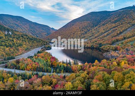 A beautiful shot of Echo lake and colorful fall foliage in Franconia