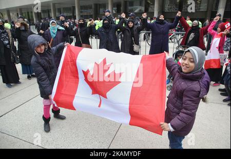 Muslim women and children form a 'circle of peace' during a rally against Islamophobia, White Supremacy & Fascism in downtown Toronto, Ontario, Canada, on May 06, 2017. Protesters clashed with anti-Muslim and fascist groups while hundreds of police officers were deployed to maintain control. Groups such as the Concerned Coalition of Canadian Citizens, the Soldiers of Odin, and the Jewish Defense League blame Muslims for unemployment, austerity and social cuts. (Photo by Creative Touch Imaging Ltd./NurPhoto) *** Please Use Credit from Credit Field *** Stock Photo