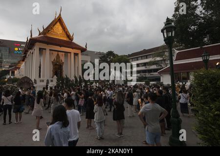 Visakha Bucha, the Buddhist holiday that marks the day of Buddha's birth, death, and day of reaching nirvana, is celebrated at Bangkok's Wat Pathum Wan on May 10th, 2017. Devotees came and offered donations of money and goods in order to make merit, as well as taking part in the tien wian procession at dusk, walking around the inner temple grounds at dusk holding lotus flowers and candles. (Photo Adryel Talamantes/NurPhoto) *** Please Use Credit from Credit Field *** Stock Photo