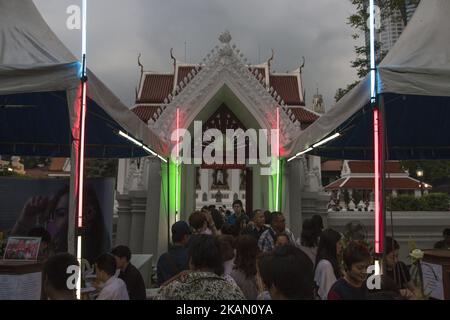 Visakha Bucha, the Buddhist holiday that marks the day of Buddha's birth, death, and day of reaching nirvana, is celebrated at Bangkok's Wat Pathum Wan on May 10th, 2017. Devotees came and offered donations of money and goods in order to make merit, as well as taking part in the tien wian procession at dusk, walking around the inner temple grounds at dusk holding lotus flowers and candles. (Photo Adryel Talamantes/NurPhoto) *** Please Use Credit from Credit Field *** Stock Photo