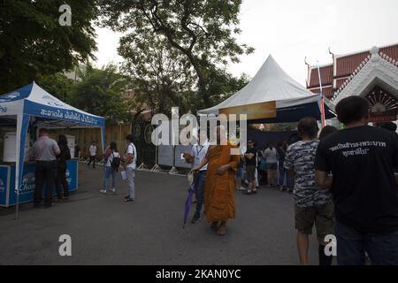 Visakha Bucha, the Buddhist holiday that marks the day of Buddha's birth, death, and day of reaching nirvana, is celebrated at Bangkok's Wat Pathum Wan on May 10th, 2017. Devotees came and offered donations of money and goods in order to make merit, as well as taking part in the tien wian procession at dusk, walking around the inner temple grounds at dusk holding lotus flowers and candles. (Photo Adryel Talamantes/NurPhoto) *** Please Use Credit from Credit Field *** Stock Photo