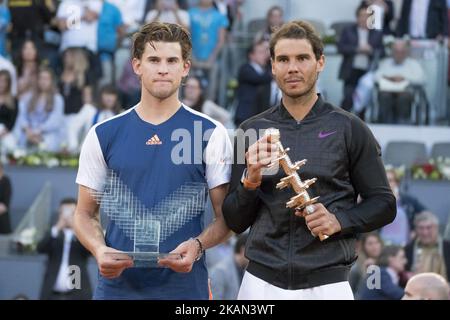 Spanish tennis player Rafael Nadal (R) and Austrian tennis player Dominic Thiem pose with their trophies at the end of their ATP Madrid Open final match in Madrid, on May 14, 2017. Nadal won 7-6 and 6-4. (Photo by Oscar Gonzalez/NurPhoto) *** Please Use Credit from Credit Field *** Stock Photo