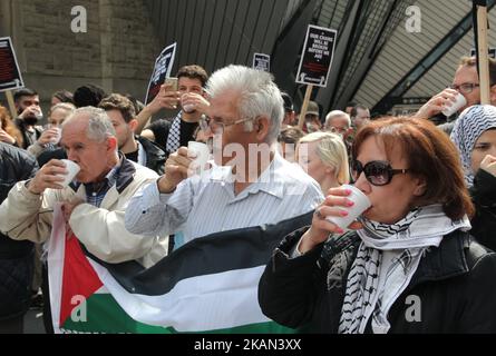 Protestors drink salt water (which is what Palestinians imprisoned in Israeli jails have been drinking) as hundreds took part in a rally to show solidarity with Palestinian political prisoners being held in Israeli prisons. The rally took place across from the Israeli Consulate in downtown Toronto, Ontario, Canada, on May 13, 2017, and was meant to urge the Canadian government to pressure the Israeli government to stop violating prisoners rights. More than 1,500 Palestinian political prisoners in Israeli jails launched a hunger strike on April 17 for their basic human rights. (Photo by Creativ Stock Photo