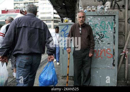 A man stands in a corner at Omonia square, central Athens, during a protest rally organized by PAME (All Workers Militant Front) on Wednesday May 17, 2017. Thousands participated to protest marches, during 24-hour nationwide general strike called by the countrys two biggest public and private labor unions, General Confederation of Employees of Greece (GSEE) and the Civil Servants' Confederation (ADEDY). Workers are protesting against the governments new deal with Greece's international creditors that imposes new tax hikes and spending cuts. (Photo by Panayotis Tzamaros/NurPhoto) *** Please Use Stock Photo