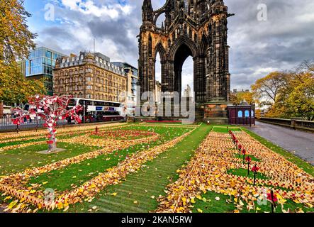 Edinburgh Scotland on Princes Street hundreds of wooden crosses and red poppies surround the Scott Monument for Remembrance Sunday 2022 Stock Photo