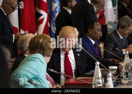 German Chancellor Angela Merkel (L) talks to U.S. President Donald Trump during the G7 Summit expanded session in Taormina, Sicily, on May 27, 2017. (Photo by Christian Minelli/NurPhoto) *** Please Use Credit from Credit Field *** Stock Photo