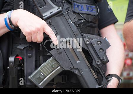 An Armed Police Officer holds a gun whilst on patrol, after the bombing of the Manchester Arena, in Manchester, United Kingdom on Saturday, May 27th, 2017. Greater Manchester Police are treating the explosion after the Ariana Grande concert, which took place on 05/22/2017 at Manchester Arena, as a terrorist incident. (Photo by Jonathan Nicholson/NurPhoto) *** Please Use Credit from Credit Field *** Stock Photo