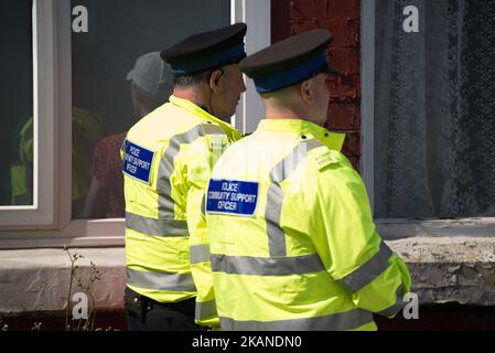 Police Community Support Officers speak to a person on the street where part of the investigation in to the Manchester Arena explosion is taking place, in Manchester, United Kingdom, Wednesday, May 31, 2017. Greater Manchester Police are treating the explosion after the Ariana Grande concert, which took place on 05/22/2017 at Manchester Arena, as a terrorist incident. (Photo by Jonathan Nicholson/NurPhoto) *** Please Use Credit from Credit Field *** Stock Photo