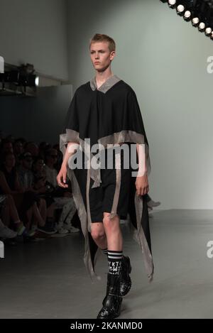 A model walks the runway at the KTZ show during the London Fashion Week Men's June 2017 collections, London on June 10, 2017. KTZ is a contemporary London-based fashion label under the creative direction of Marjan Pejoski and management of Sasko Bezovski. KTZ designs men’s and women’s ready-to-wear clothing with couture detailing known for its raw energy and contemporary urban edge, but also for embracing ethnographic references and multiculturalism. (Photo by Alberto Pezzali/NurPhoto) *** Please Use Credit from Credit Field *** Stock Photo