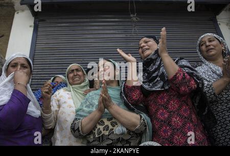 Kashmiri women grieve as they watch the funeral procession of local rebel Adil Ahmed, Saturday, June 17, 2017, on the outskirts of Srinagar, Indian-administered Kashmir. Three militants were killed Saturday in a gun battle with government forces in the disputed region. Two civilians were killed and dozens of others injured in clashes that erupted near the gunfight site, officials said. (Photo by Ahmer Khan/NurPhoto) *** Please Use Credit from Credit Field *** Stock Photo