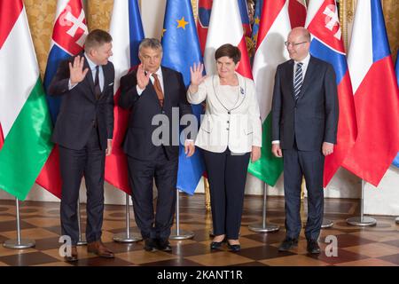 Prime Ministers of Visegrad Group countries (L-R): Slovakia's Robert Fico, Hungary's Viktor Orban, Poland's Beata Szydlo and Czech Republic's Bohuslav Sobotka shake hands during their meeting at the Royal Castle in Warsaw, Poland on June 19, 2017 (Photo by Mateusz Wlodarczyk/NurPhoto) *** Please Use Credit from Credit Field *** Stock Photo