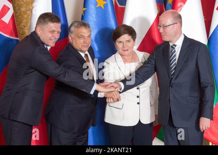 Prime Ministers of Visegrad Group countries (L-R): Slovakia's Robert Fico, Hungary's Viktor Orban, Poland's Beata Szydlo and Czech Republic's Bohuslav Sobotka shake hands during their meeting at the Royal Castle in Warsaw, Poland on June 19, 2017 (Photo by Mateusz Wlodarczyk/NurPhoto) *** Please Use Credit from Credit Field *** Stock Photo