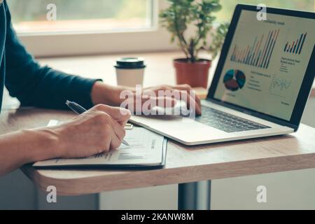 close up. casual young man working on a laptop . Stock Photo
