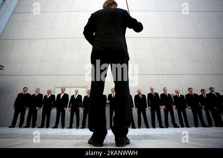 Mieskuoro Huutajat (Screaming Men's Choir) at the SNFCC in Athens, Greece, June 22, 2017. Mieskuoro Huutajat is a Finnish choir founded in 1987 by Petri Sirvio, composer and conductor of the group, that doesn't sing a note. In their signature style, the choir members, decently dressed in black suits, enter their venues in a paramilitary-like manner and begin to scream, bellow and shout excerpts from texts that can range from national anthems and folk songs to children's ditties, poetry and international treaties. (Photo by Giorgos Georgiou/NurPhoto) *** Please Use Credit from Credit Field *** Stock Photo