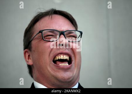 Mieskuoro Huutajat (Screaming Men's Choir) at the SNFCC in Athens, Greece, June 22, 2017. Mieskuoro Huutajat is a Finnish choir founded in 1987 by Petri Sirvio, composer and conductor of the group, that doesn't sing a note. In their signature style, the choir members, decently dressed in black suits, enter their venues in a paramilitary-like manner and begin to scream, bellow and shout excerpts from texts that can range from national anthems and folk songs to children's ditties, poetry and international treaties. (Photo by Giorgos Georgiou/NurPhoto) *** Please Use Credit from Credit Field *** Stock Photo