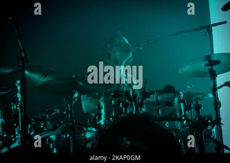 https://l450v.alamy.com/450v/2kap0gm/george-daniel-of-the-english-rock-band-the-1975-pictured-on-stage-as-they-perform-at-fabrique-in-milan-italy-on-june-29-2017-the-1975-announced-the-2017-european-tour-to-support-the-album-that-has-won-1-of-the-official-uk-and-us-charts-photo-by-roberto-finizionurphoto-please-use-credit-from-credit-field-2kap0gm.jpg