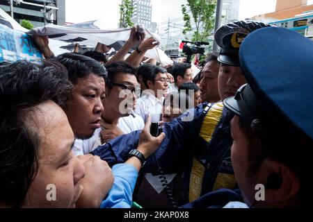 Anti-Abe protesters clash with Japanese police during the speech of Japanese Prime Minister Shinzo Abe for his candidate Aya Nakamura of main opposition, Liberal Democratic Party (LDP) in Akihabara, Tokyo, Japan on July 1, 2017. Tokyo Metropolitan Assembly election will be held on July 2. (Photo by Richard Atrero de Guzman/NurPhoto) *** Please Use Credit from Credit Field *** Stock Photo