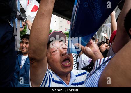 Anti-Abe protesters gathers and chant “Abe wa Yamero!” 'Resign Prime Minister Abe!” during the speech of Japanese Prime Minister Shinzo Abe for his candidate Aya Nakamura of main opposition, Liberal Democratic Party (LDP) in Akihabara, Tokyo, Japan on July 1, 2017. Tokyo Metropolitan Assembly election will be held on July 2. (Photo by Richard Atrero de Guzman/NurPhoto) *** Please Use Credit from Credit Field *** Stock Photo