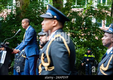 Antoin Deul, President of the National Institute for the Study of Dutch Slavery and its Legacy (NiNsee) in Amsterdam, on July 1, 2017. Bigi Spikri is a Surinamese term literally means 'big mirror', it's a cozy and colorful procession in traditional costumes to commemorate and celebrate the abolition of slavery. During this annual festive parade in Suriname, people wearing native costumes walked in front of the shop windows of Paramaribo, using these as large mirrors where they admired themself. Since 2009 there is an annual Bigi Spikri parade in Amsterdam. After the procession, takes place the Stock Photo