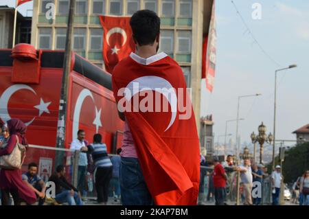 A man is seen wearing a Turkish flag before a march to the 1st anniversary of Turkey's failed coup attempt in Ankara, Turkey on July 15, 2017. (Photo by Altan Gocher/NurPhoto) *** Please Use Credit from Credit Field *** Stock Photo