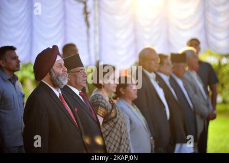 Manjeev Singh Puri, Ambassador of India to Nepal, former prime minister Puspa Kamal Dahal and other ministers and stands as the National anthem plays during reception hosted at India House to mark 70 Years of India's independence at Kathmandu, Nepal on August 11, 2017. (Photo by Narayan Maharjan/NurPhoto) *** Please Use Credit from Credit Field *** Stock Photo