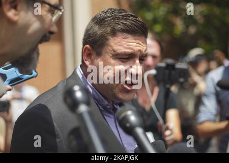 Alt-right blogger Jason Kessler waits for protesters to quiet before begnning a news conference in front of City Hall on August 13, 2017 in Charlottesville, Virginia. Kessler, who helped organize the Unite the Right rally one day earlier, blamed Charlottesville government officials and law enforcement for failing to protect the first amendment rights of the rally's participants, a collection of white supremacists, neo-Nazis, Ku Klux Klan members and alt-right supporters. (Photo by Shay Horse/NurPhoto) *** Please Use Credit from Credit Field *** Stock Photo