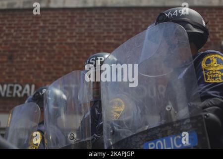 State Police Formed up and made Walls around Jason Kessler in front of City Hall on August 13, 2017 in Charlottesville, Virginia. Kessler, who helped organize the Unite the Right rally one day earlier, blamed Charlottesville government officials and law enforcement for failing to protect the first amendment rights of the rally's participants, a collection of white supremacists, neo-Nazis, Ku Klux Klan members and alt-right supporters. (Photo by Shay Horse/NurPhoto) *** Please Use Credit from Credit Field *** Stock Photo