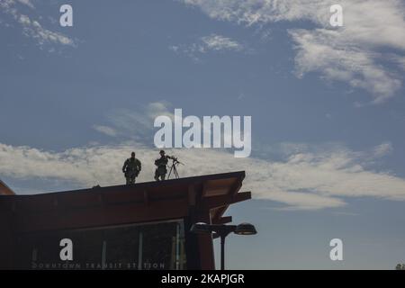 A Virginia State Police counter-sniper team stands watch before a news conference held by alt-right blogger Jason Kessler in front of City Hall August 13, 2017 in Charlottesville, Virginia. Kessler, who helped organize the Unite the Right rally one day earlier, blamed Charlottesville government officials and law enforcement for failing to protect the first amendment rights of the rally's participants, a collection of white supremacists, neo-Nazis, Ku Klux Klan members and alt-right supporters. (Photo by Shay Horse/NurPhoto) *** Please Use Credit from Credit Field *** Stock Photo