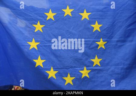 Anti Brexit demonstrators are seen waving European Union flags against the backdrop of the Big Ben, London on August 21, 2017. The UK government has set out proposals to ensure trade in goods and services can continue on the day the UK leaves the EU in March 2019. (Photo by Alberto Pezzali/NurPhoto) Stock Photo