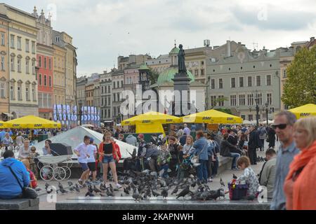 A view of very busy Krakow's Main Market Square. On Wednesday, August 22, 2017, in Krakow, Poland. (Photo by Artur Widak/NurPhoto)  Stock Photo