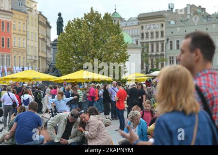 A view of very busy Krakow's Main Market Square. On Wednesday, August 22, 2017, in Krakow, Poland. (Photo by Artur Widak/NurPhoto)  Stock Photo