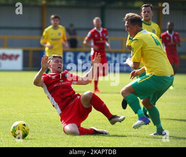 Jake Robinson of Billericay Town gets tackled by Richard Halle of Thurrock FC during Bostik League Premier Division match between Thurrock vs Billericay Town at Ship Lane Ground, Aveley, UK on August 28, 2017. (Photo by Kieran Galvin/NurPhoto) Stock Photo