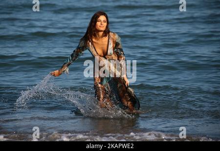 Isabeli Fontana poses for photographers ahead of the 74th Venice Film Festival on August 29, 2017 in Venice, Italy. Stock Photo