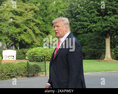 US President Donald Trump speaks to reporters as he walks to the White House in Washington, DC, on August 30, 2017 upon his return from Springfield, Missouri, where he spoke about tax reform. (Photo by Kyle Mazza/NurPhoto) Stock Photo