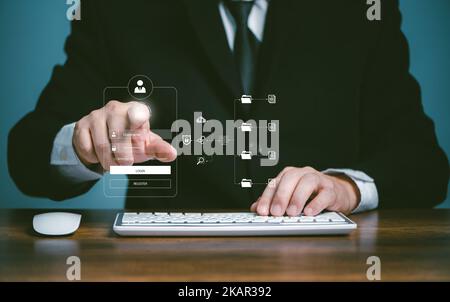 Cybersecurity cloud network systerm privacy protect data concept, Businessman using computer and touching fingerprint to scan the protection system cy Stock Photo