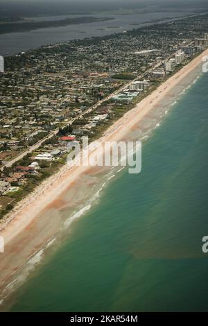 An aerial drone view of beautiful sandy Ormond beach and sea with calm waves Stock Photo