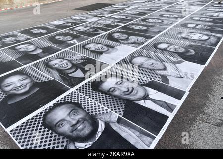 The street artist JR performing the Inside Out Project at the Mairie d'issy, in Paris, France, on September 16, 2017. JR is the pseudonym of a French photographer and artist whose identity is unconfirmed. (Photo by Julien Mattia/NurPhoto) Stock Photo