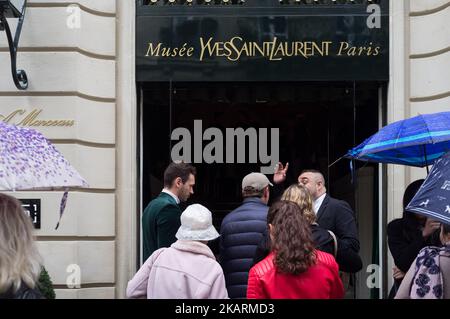 free Pre-oppening of the new Yves Saint Laurent museum in Paris turn in a four hours queing line on a rainy on 01 October 2017 in Paris, France.(Photo by Julien Mattia/NurPhoto) Stock Photo