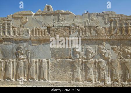 Ancient Persepolis, a capital of the Achaemenid Empire 550 - 330 BC in Iran, a UNESCO world heritage site. . Archaelogical site and ruins of gates and columns of the Persian Achaemenid dynasty ancient capital city of Takht-e Jamshid, or Persepolis, destroyed by Alexander the Great, the Greek Macedonian king, a UNESCO World Heritage site and touristic landmark of Iran, near the southern city of Shiraz in Fars province. Some of the most famous landmarks there are the Gate of All Nations, Palace of Darius the Great, also known as the Tachara, Intricate carving, Carved Achaemenid columns, double h Stock Photo
