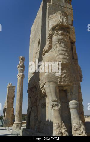 Ancient Persepolis, a capital of the Achaemenid Empire 550 - 330 BC in Iran, a UNESCO world heritage site. . Archaelogical site and ruins of gates and columns of the Persian Achaemenid dynasty ancient capital city of Takht-e Jamshid, or Persepolis, destroyed by Alexander the Great, the Greek Macedonian king, a UNESCO World Heritage site and touristic landmark of Iran, near the southern city of Shiraz in Fars province. Some of the most famous landmarks there are the Gate of All Nations, Palace of Darius the Great, also known as the Tachara, Intricate carving, Carved Achaemenid columns, double h Stock Photo