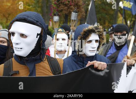 Ukrainian far-right activists from different nationalist parties attend a 'March of Glory of Heroes' in central Kiev, Ukraine on October 14, 2017. About twenty thousands of far-right activists gathered in the Ukrainian capital to celebrate the 75th anniversary of the establishment of the Ukrainian Insurgent Army (UPA). (Photo by STR/NurPhoto) Stock Photo