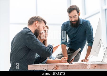 colleagues extending their hands to each other for a handshake Stock Photo