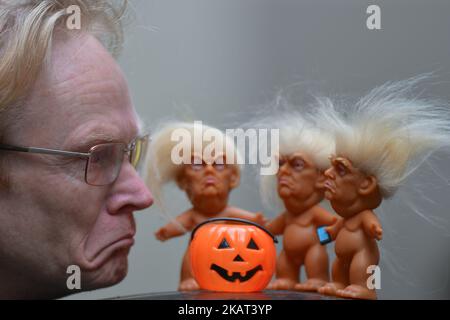 Gallery owner Frank O'Dea with three vinyl dolls which feature President Donald Trump, made by a former sculptor for Disney, Chuck Williams. Donald Trump Troll dolls can be seen and bought at Balla Ban Art Gallery in Dublin city center, ahead of Halloween. On Wednesday, 24 October 2017, in Dublin, Ireland. Photo by Artur Widak  Stock Photo